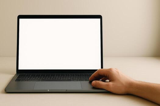 de cerca de un de la persona mano descansando en el trackpad de un abierto ordenador portátil con un blanco blanco pantalla en un neutral superficie, sugerencia productividad y digital Interacción foto