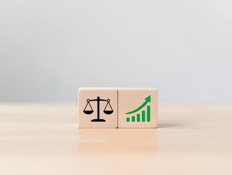 Wooden Blocks with Balance Scale and Growth Chart Icons on Beige Background photo