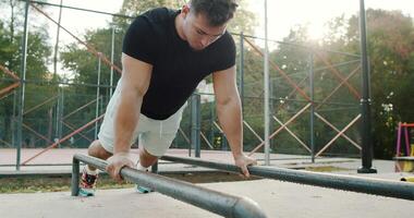 Engaging in an intense calisthenics session Enjoying a dynamic pushup workout in the park video