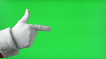 Santa Claus Hand Pointing to the Front with Index Finger Isolated On Green Background. Close Up. White Gloved Hand Points Forward at Something with one finger. Chroma Key Screen. Advertisement gesture video