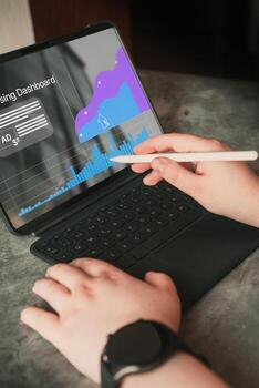 Analyst uses digital tablet and dashboard for data business analysis. Data Management System concept. Technology finance, sales and marketing operations. photo