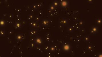 gyllene partikel bokeh lampor rörelse bakgrund - animering av skimrande, gyllene bokeh partiklar långsamt flytande och lysande på en mörk brun bakgrund video