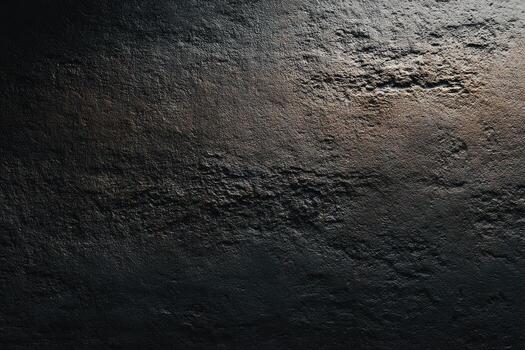 Dark, textured surface with subtle light gradients photo