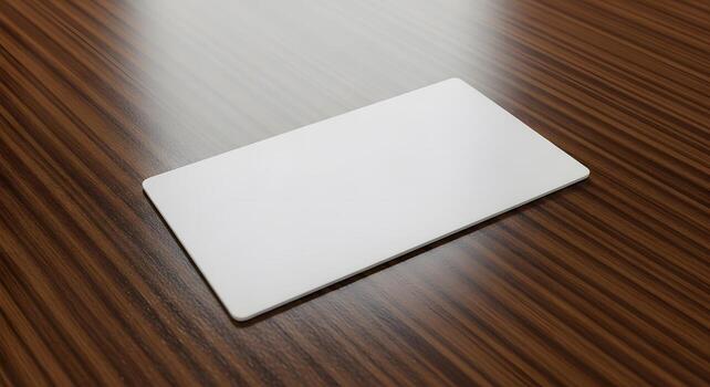 Blank white rectangular card mockup with soft rounded corners, elegantly placed on a polished dark wooden table, offering a clean canvas for branding and design projects photo