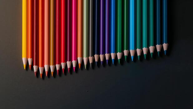 Colorful Array of Pencils on a Dark Surface, Gradient of Color and Texture. photo