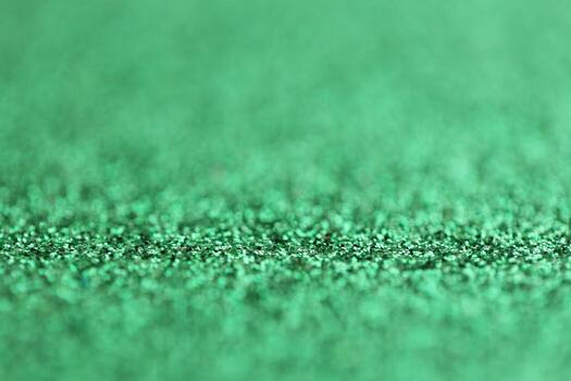 Beautiful green glitter sparks texture as background with shallow depth of field photo