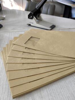Document flow. a stack of craft envelopes for mailing photo