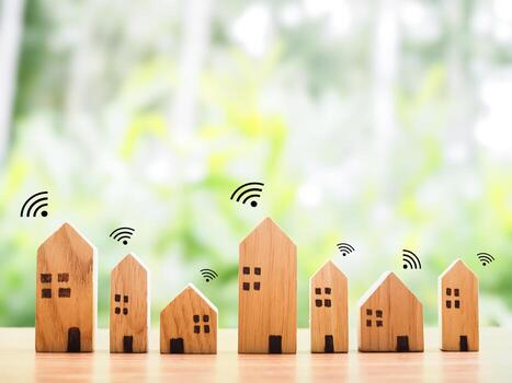 Miniature house with Wifi signal. Concept of network connect, internet of things, smart home control and automation system technology photo