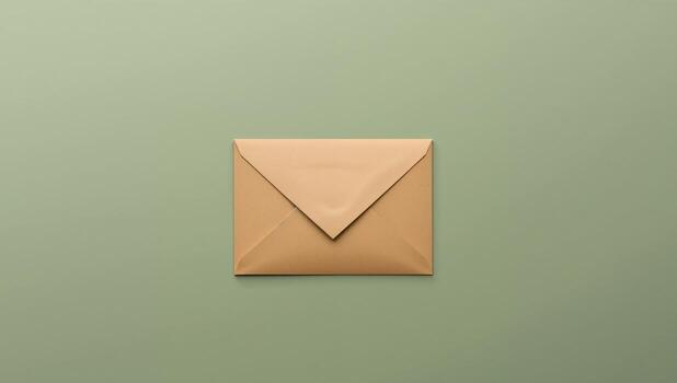 Simple Rectangular Shape. A Golden Envelope on a Gentle Green Plain Surface. photo