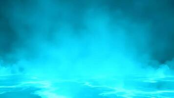 Intense Aqua Blue Mist Rises From Rippling Water Surface in Studio at Night video