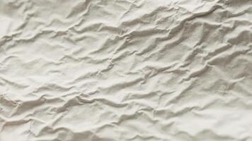 spiegazzato bianca carta struttura avvicinamento per astratto sfondo o grafico design elemento video