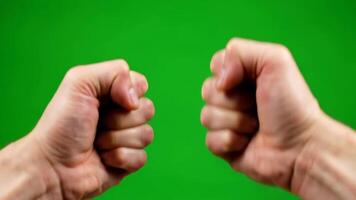 Two Fists Clenched Facing Each Other in Front of a Green Screen in the Studio video