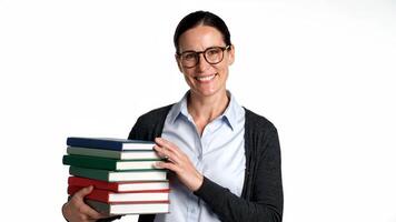 Smiling Teacher Holds Stack Of Books In Front Of White Background video