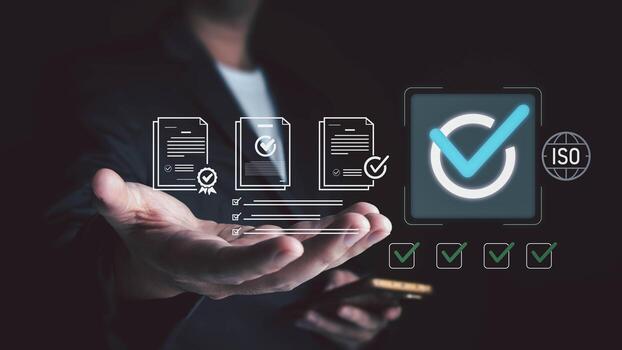 A man in a suit presents a hand holding a phone, with digital overlays of documents, checkboxes, a large checkmark, and an ISO symbol, symbolizing quality management and certification. photo