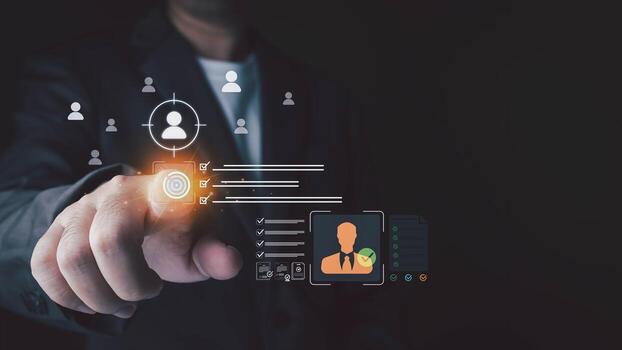 A man in a suit points at a futuristic interface with human resource management icons and checkmarks on a dark background. photo