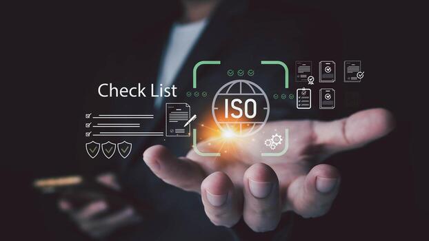 A person holds out a hand displaying a digital Check List interface with an ISO icon document icons and checkmarks representing quality management and standardization photo