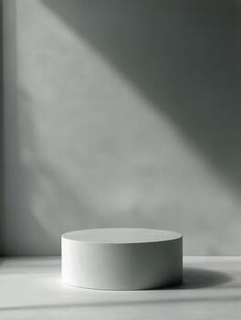 Round Pedestal in a Minimalistic Space With Soft Lighting and Shadows photo