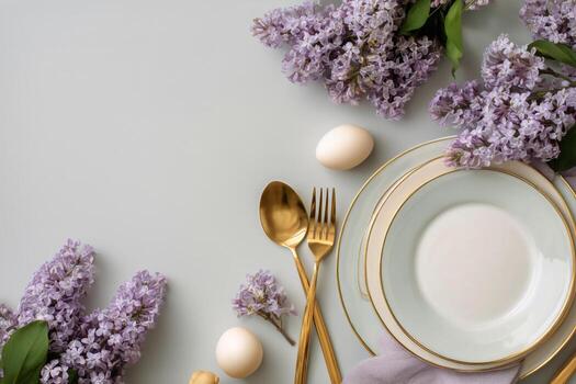 Elegant Spring Table Setting With Lilacs, Golden Cutlery, and Decorative Eggs photo