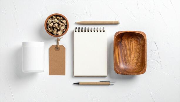 Flat lay of natural wellness ingredients notepad and pens for content creation and branding mockups on white textured background photo
