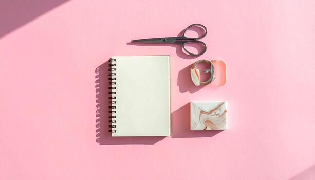 Minimalist Flat Lay Open Notebook Scissors and Marble Detail on Pink Background with Shadow Play photo