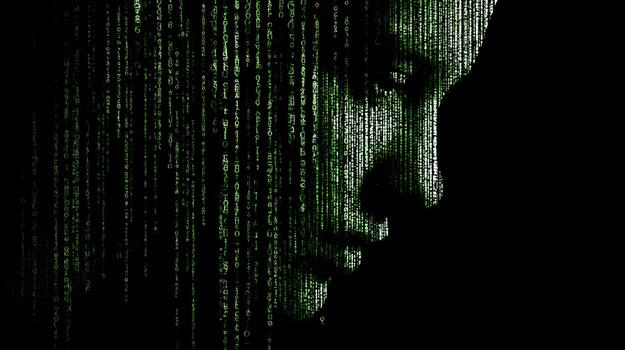 Profile silhouette of a woman with green binary code background representing technology and data photo