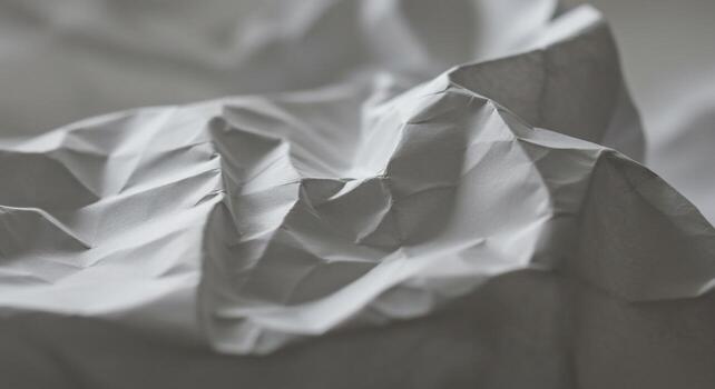 Abstract crumpled paper texture with soft shadows and subtle light play photo