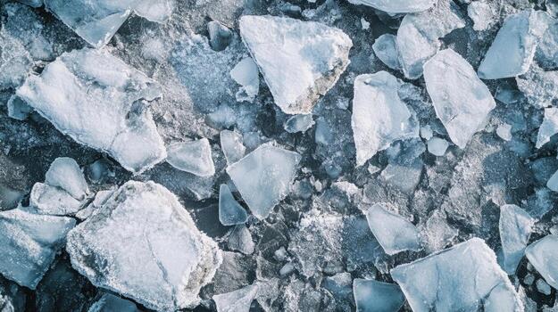 Jagged ice shards display texture and winter patterns across a frozen landscape's surface photo
