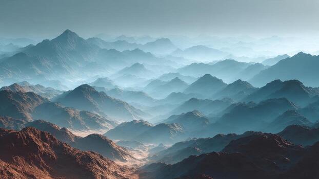 Vast misty mountain ranges stretch into the hazy horizon under a pale sky photo