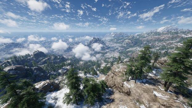 High angle view of snow dusted mountains rugged terrain and green pine forests under a bright blue cloudy sky photo