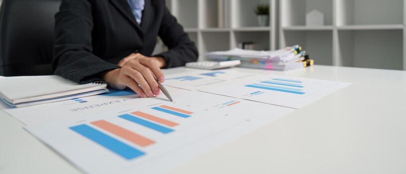 Data Visualization. Analyst interpreting financial graphs and data. photo