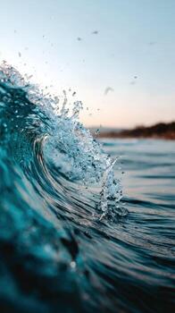 A wave breaking on the ocean with birds flying around photo