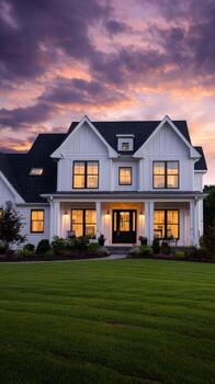 A large white house with a large front yard photo