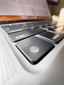 Laptop language key, laptop key, close-up macro photo, black keyboard, laptop, technology, IT, work from home, freelancing, copy space photo
