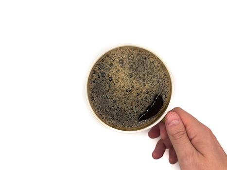 A cup of coffee. View from above. Isolated on white background. Flat lay. Top view, copy space. photo