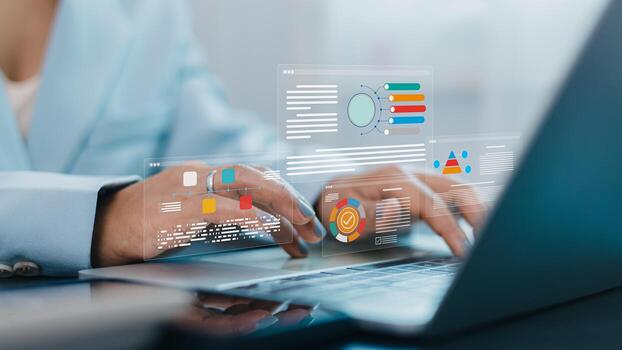 Businesswoman using laptop with data analytics dashboard and digital business report visualization photo
