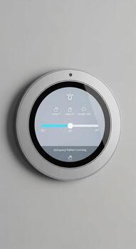 Modern smart thermostat with a sleek oval design and a bright digital display showing temperature controls photo