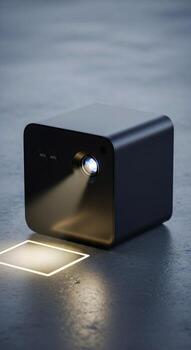Sleek modern black projector casting a bright beam of light onto a glowing square on a textured concrete surface photo