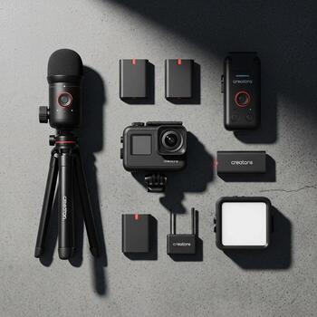 Compact digital camera and microphone setup with accessories for vlogging and content creation photo