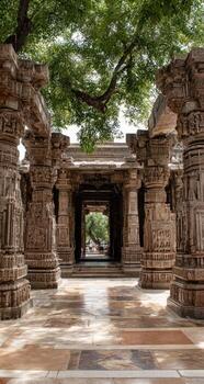 Ancient stone temple corridor, shaded by a large tree photo