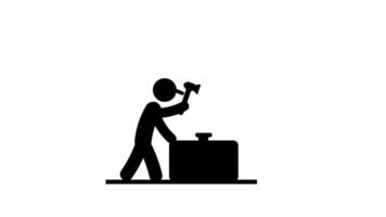 A worker hammers on a block at a workbench, symbolizing force, persistence, and the physical labor needed in construction or crafting tasks video