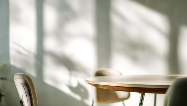 Sunlit room with a round table and chairs photo