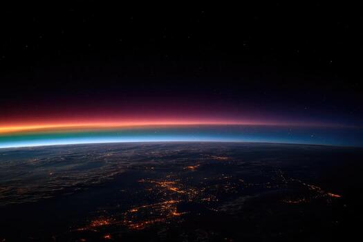 Earth's curve with vibrant atmospheric colors, seen from space photo