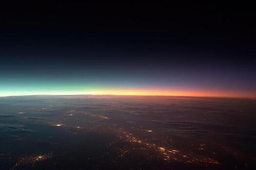 Distant view from above, with city lights glowing photo