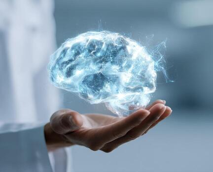 Hand holds a digital brain, light blue glow photo