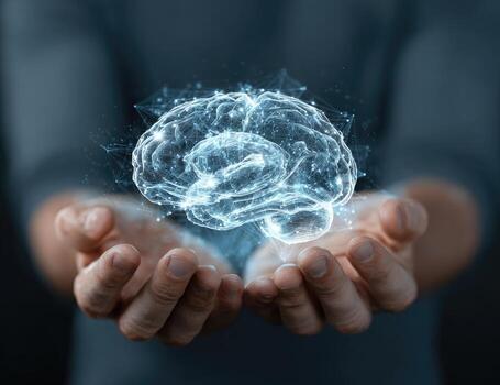 Hands holding a glowing brain photo