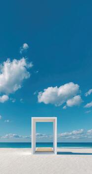 White architectural structure on a beach, blue sky, puffy clouds photo
