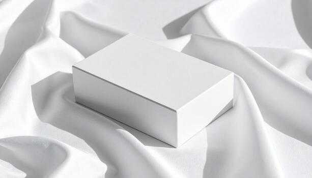 Minimalist White Box on Silky Fabric Soft Shadows Elegant Presentation. photo
