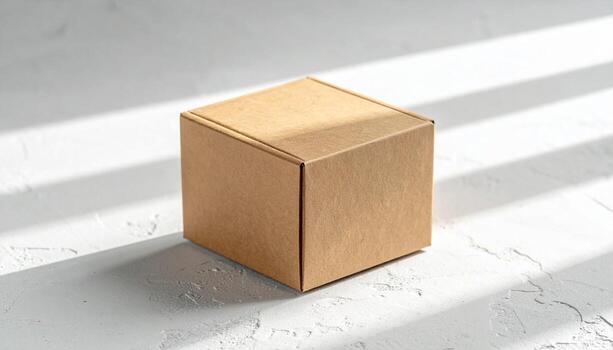 Brown cardboard box on white surface with light and shadows. photo