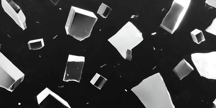 Abstract black and white background with floating translucent geometric shapes resembling ice shards photo