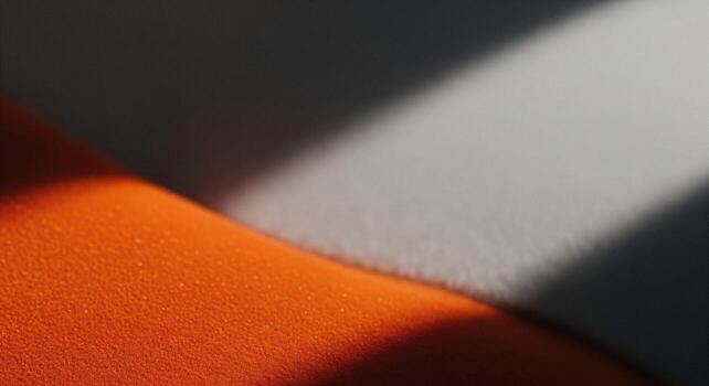Modern abstract background with vibrant orange and grey textured surfaces photo